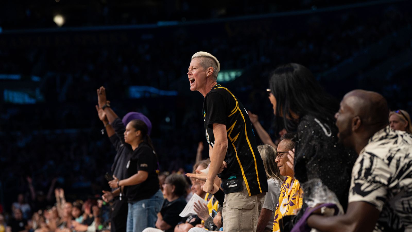 Sparks fans cheer during a WNBA game against the Valkyries.