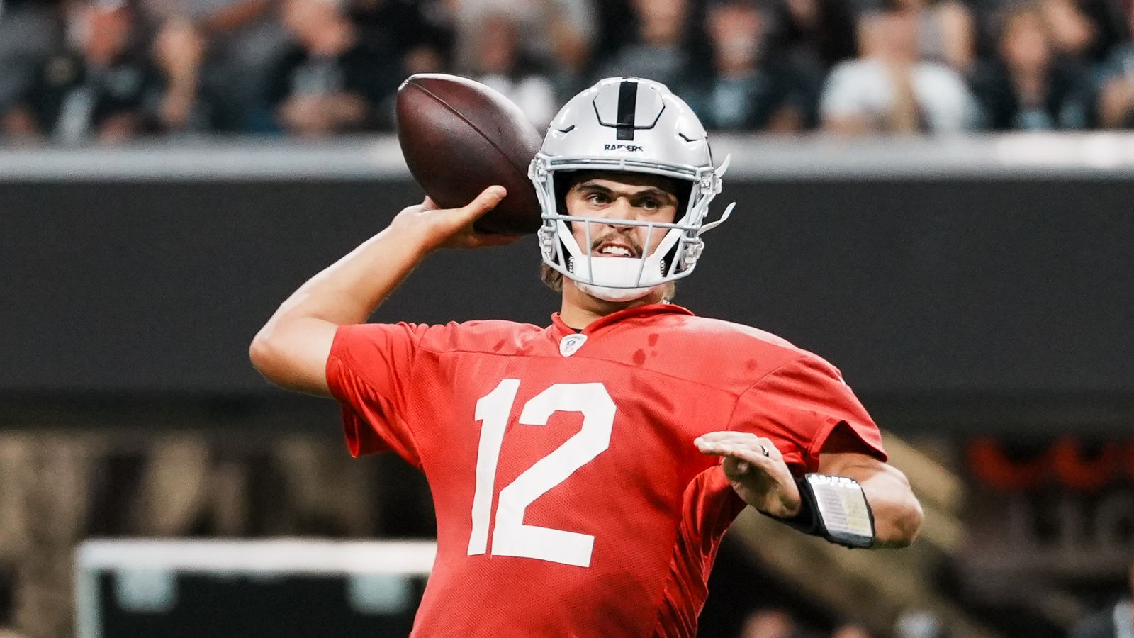 Aidan O’Connell (12) passes during Raiders practice at Allegiant Stadium
