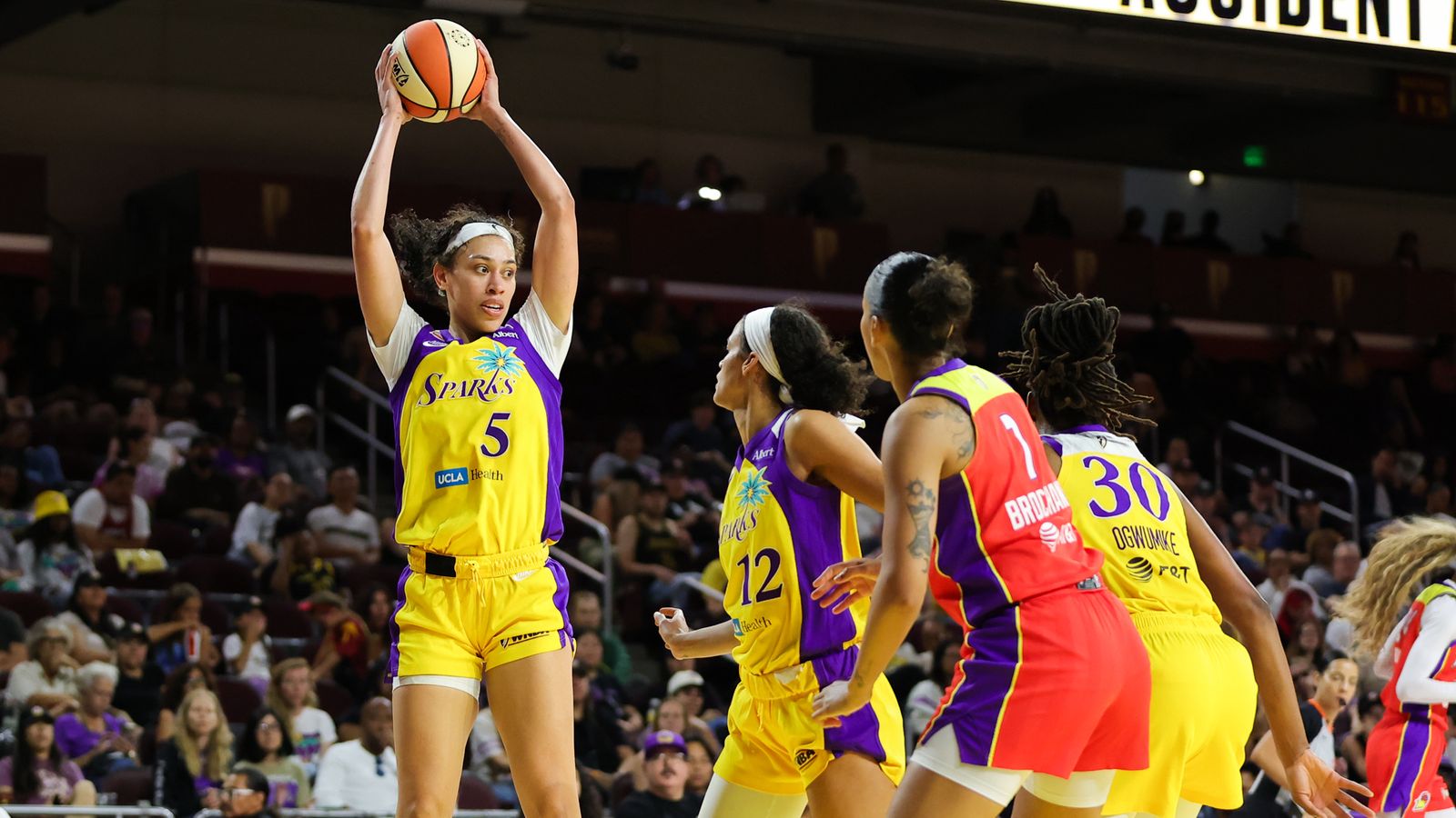 Dearica Hamby grabs a rebound in a tight WNBA clash