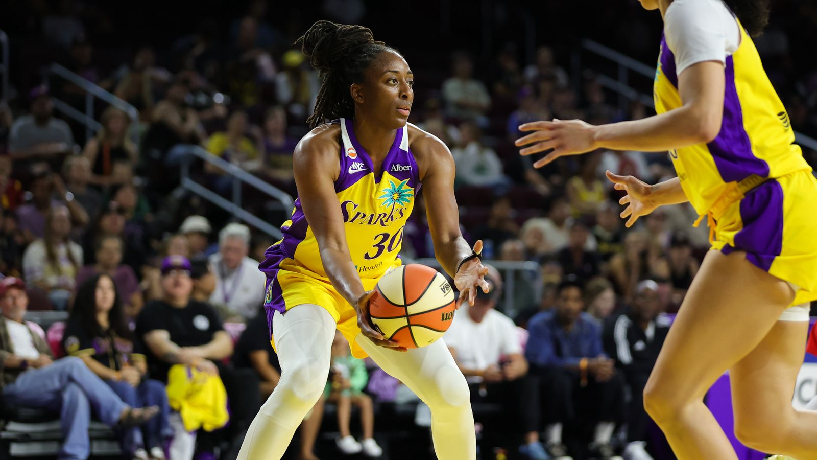 Nneka Ogwumike secures a rebound against the Mercury