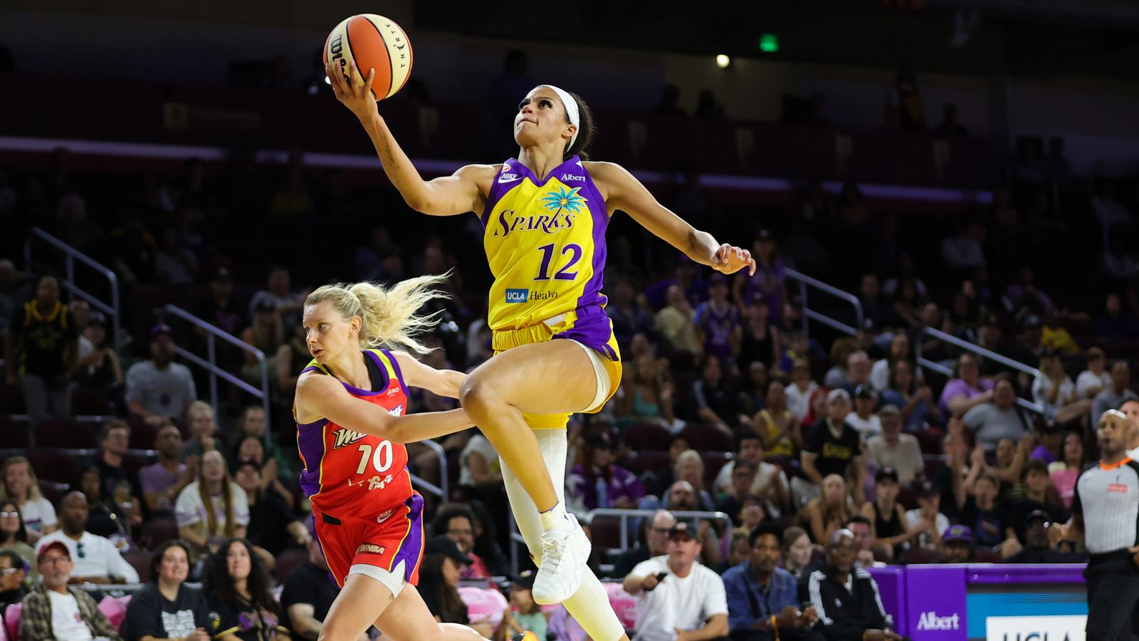 Rae Burrell attempts a lay up in WNBA game