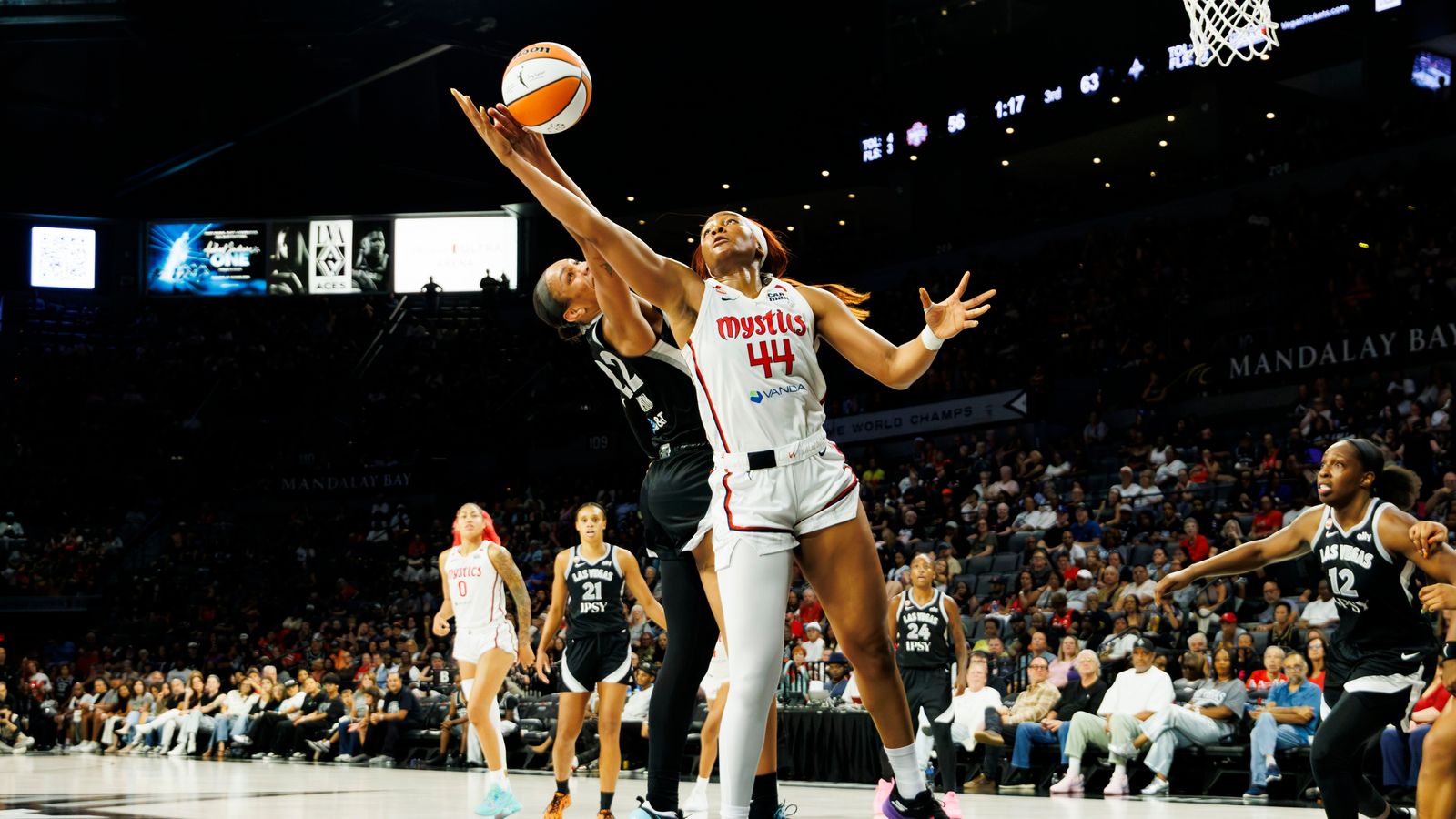 Chelsea Gray blocks a shot in WNBA game against the Mystics