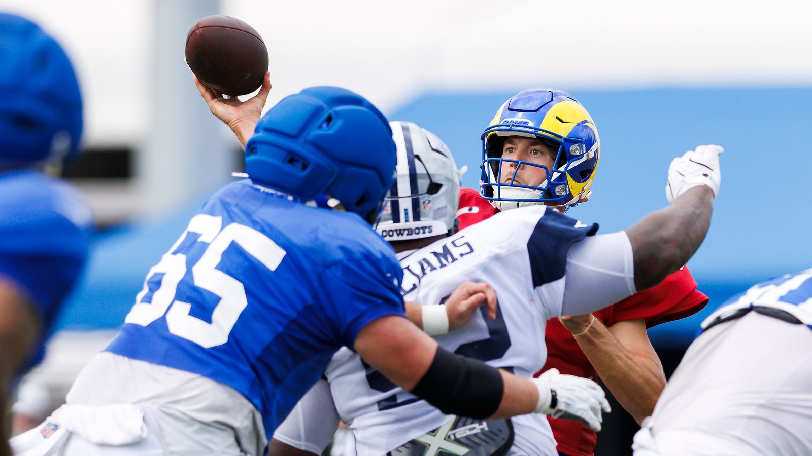 Matthew Stafford throws during joint practice at Rams Village