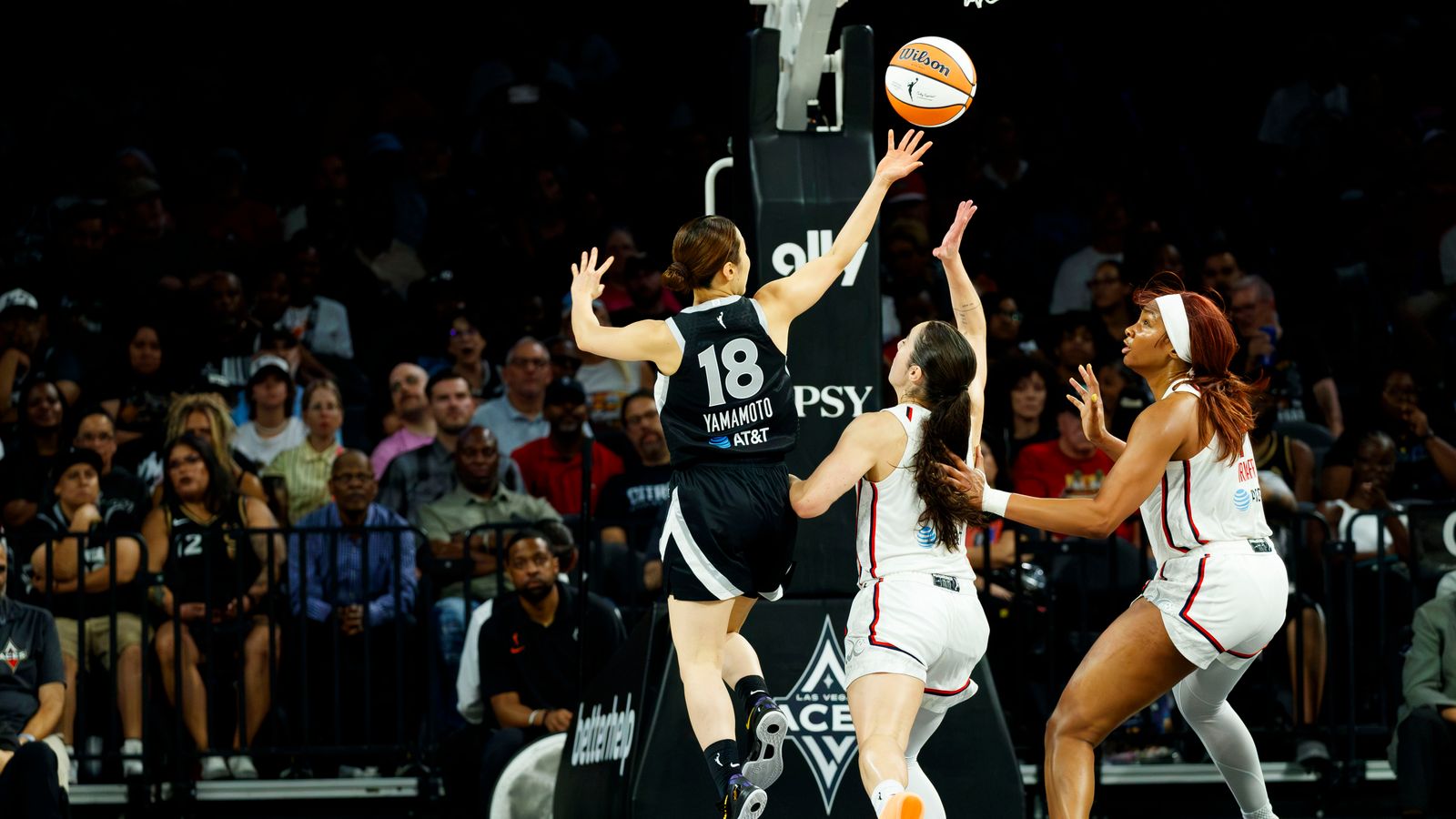 Mai Yamamoto passes the ball in WNBA game against the Mystics