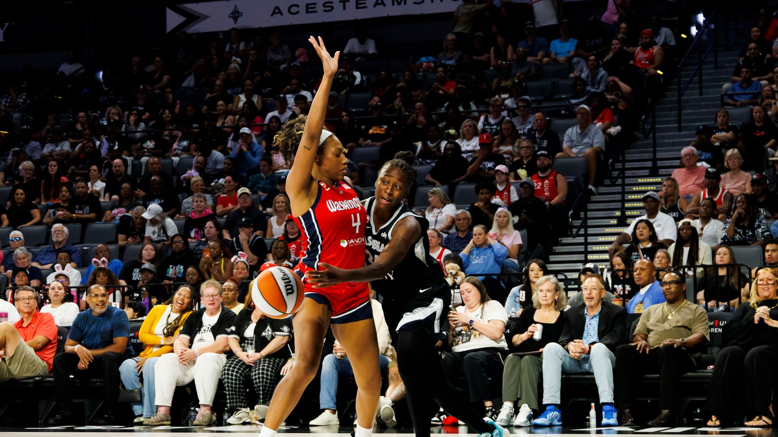 Jewell Loyd passes the ball in a tight game against the Mystics