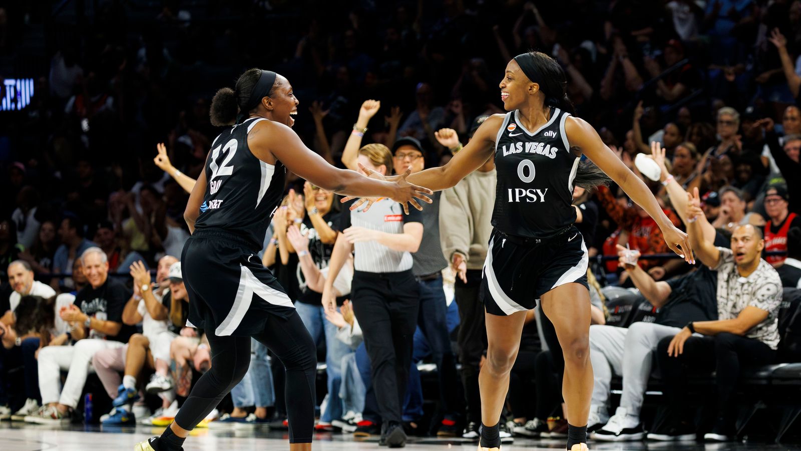 Chelsea Gray and Jackie Young celebrate a three-pointer