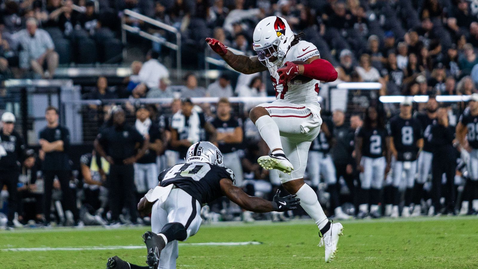 Corey Kiner hurdles over defender in exciting play