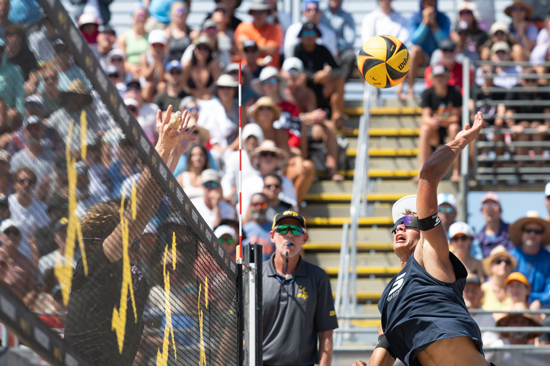 Miles Partain spikes the ball at Manhattan Beach Open