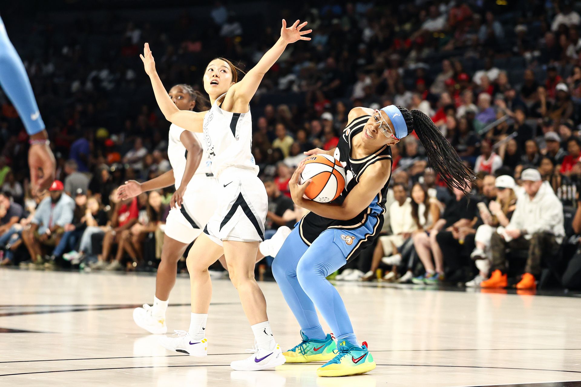 Mai Yamamoto commits a foul in a WNBA game