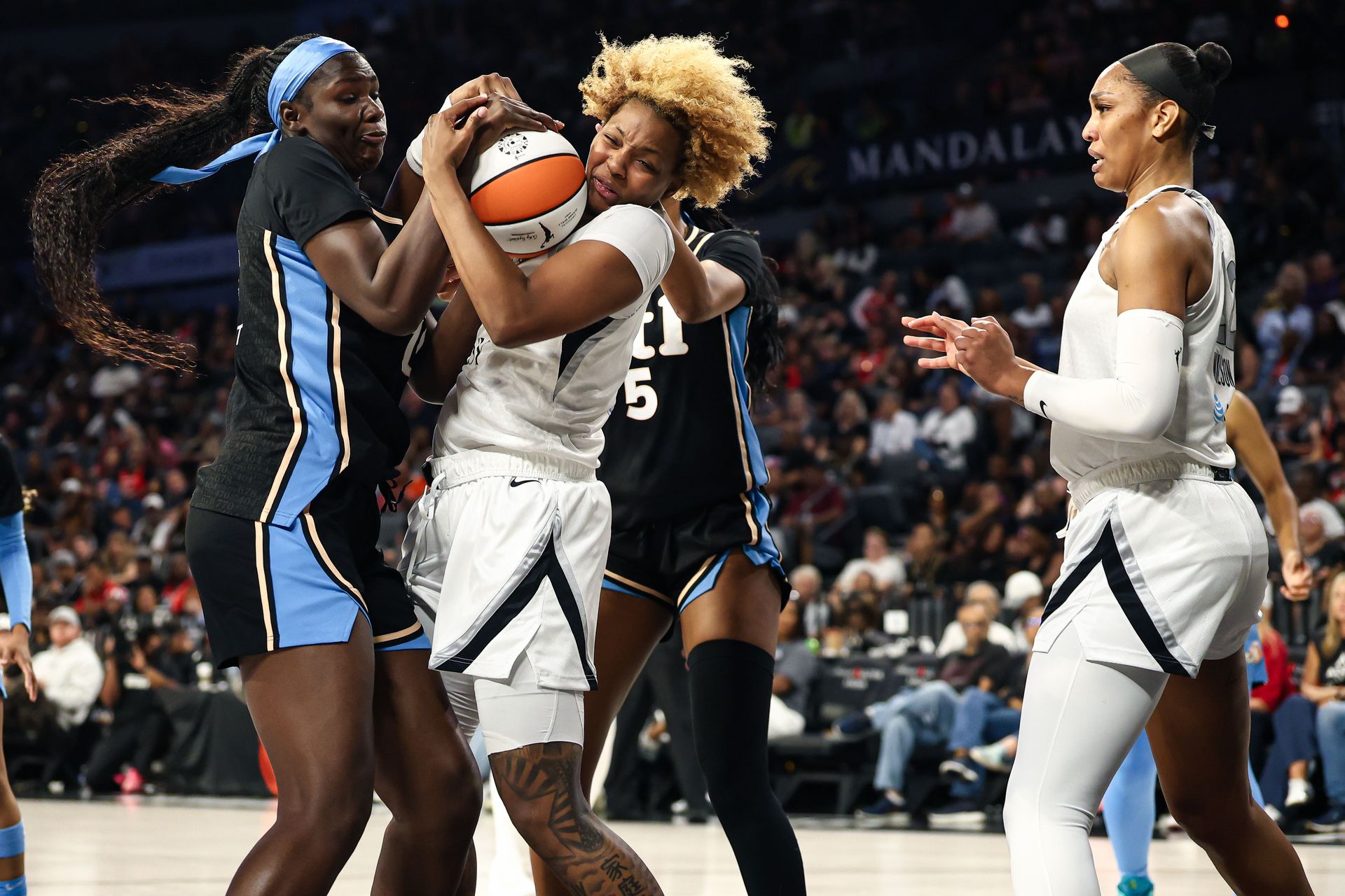 NaLyssa Smith grabs an offensive rebound for the Aces