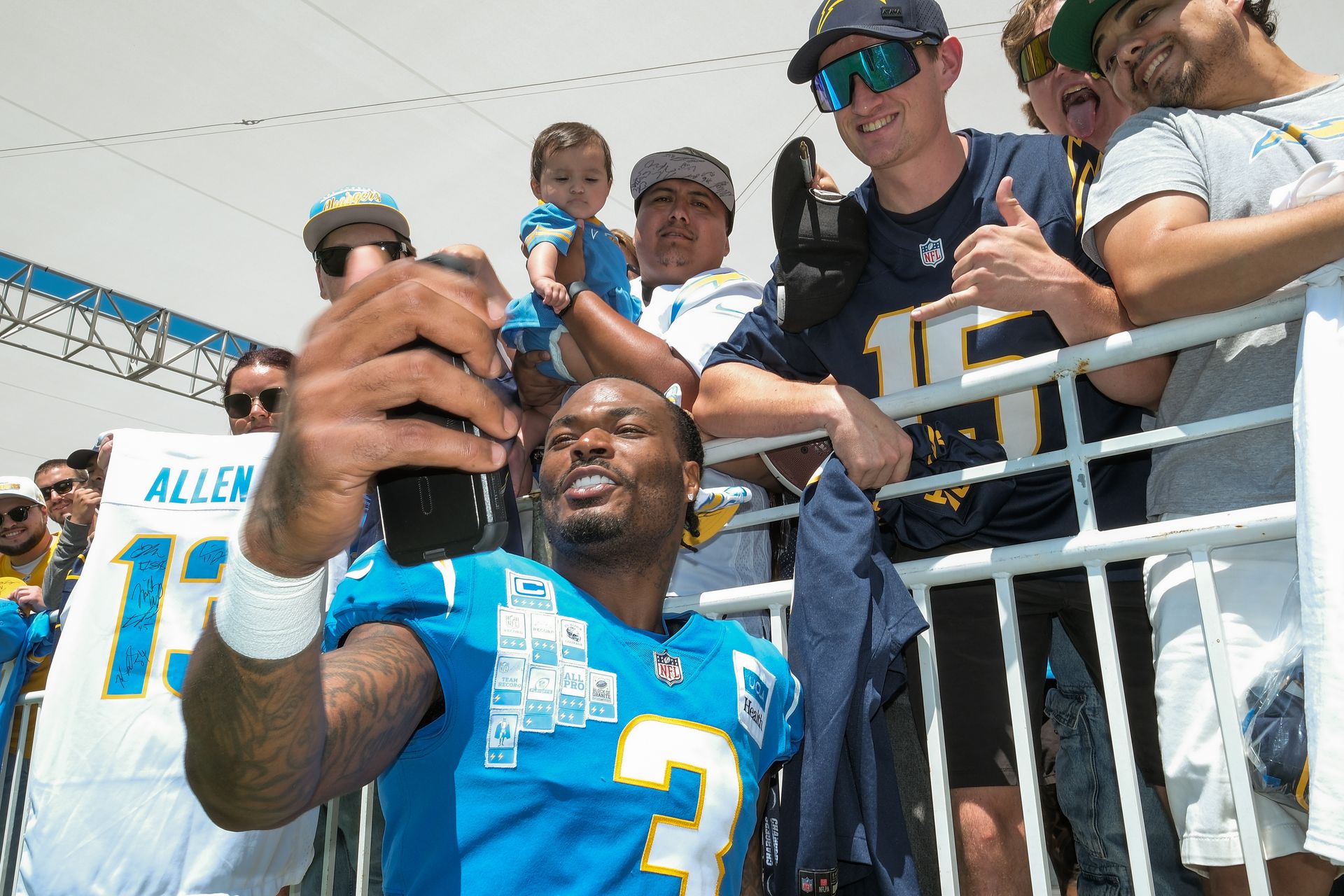 Derwin James Jr. interacts with fans at joint training camp