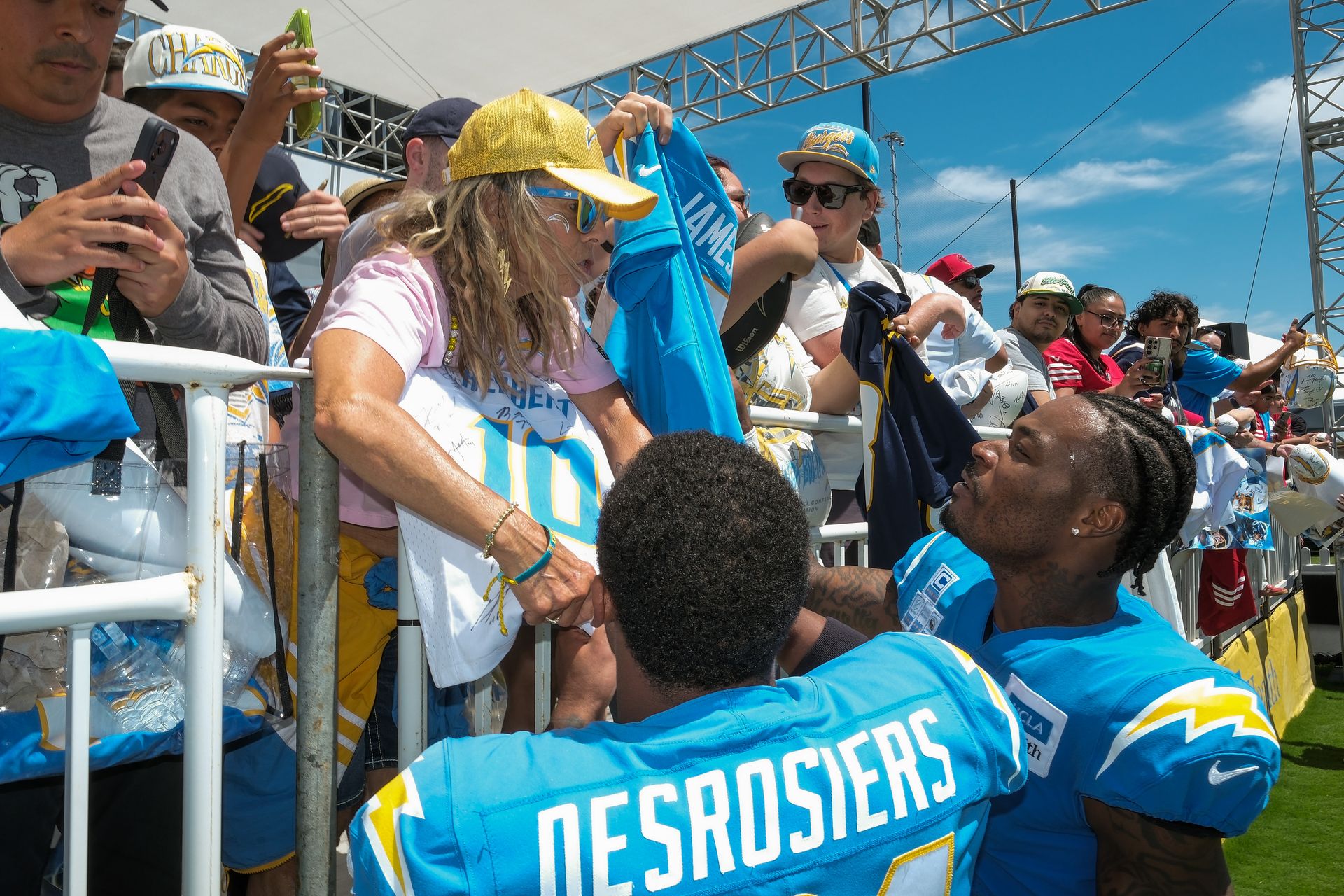 Derwin James Jr. and Greg Desrosiers sign merchandise