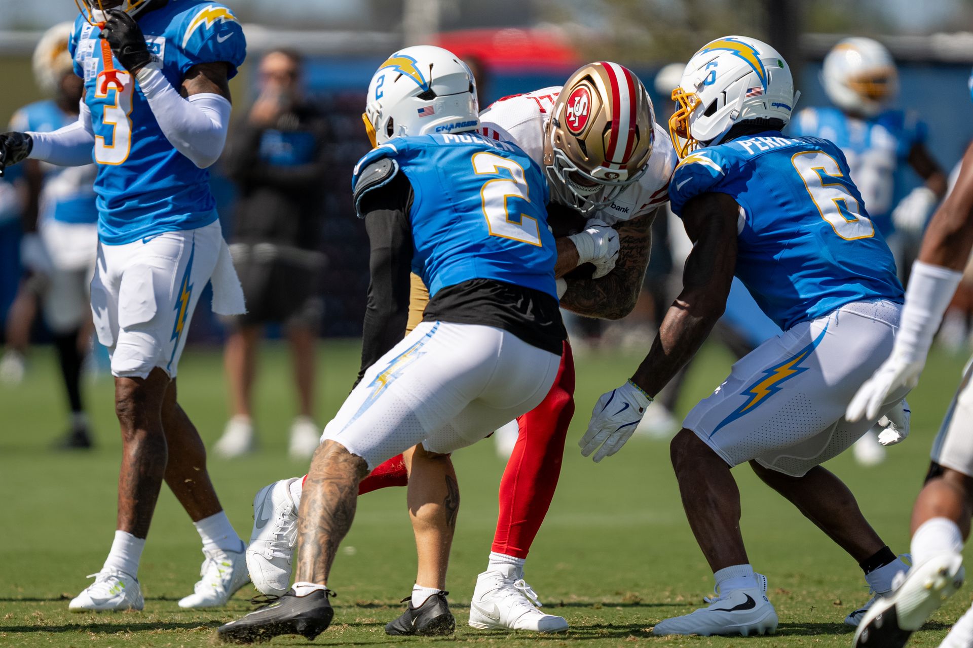 Elijah Molden and Denzel Perryman tackle Luke Farrell