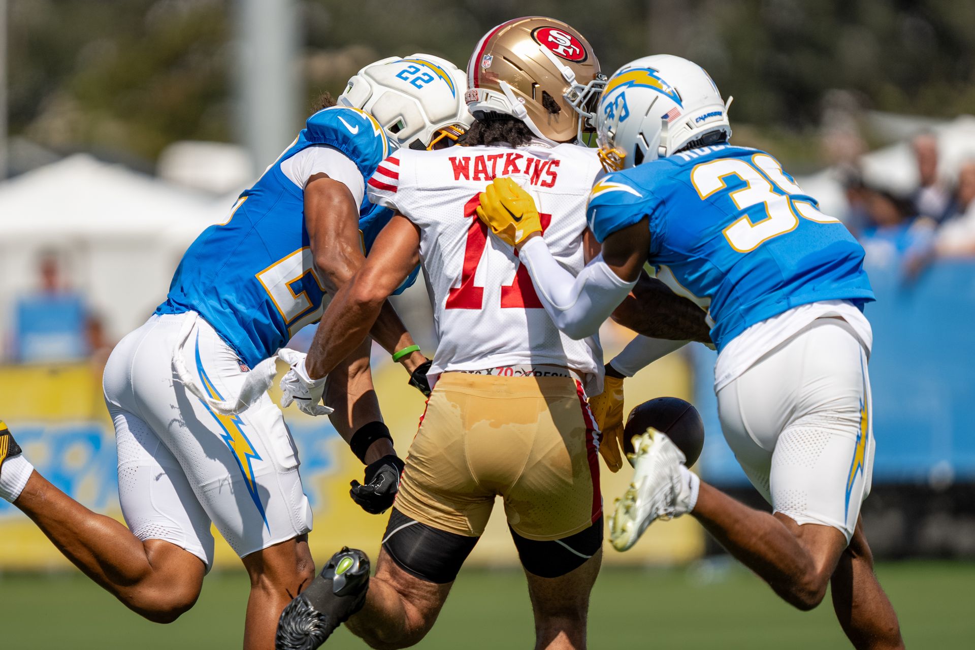 Genesis Smith and Eric Rogers break up a pass
