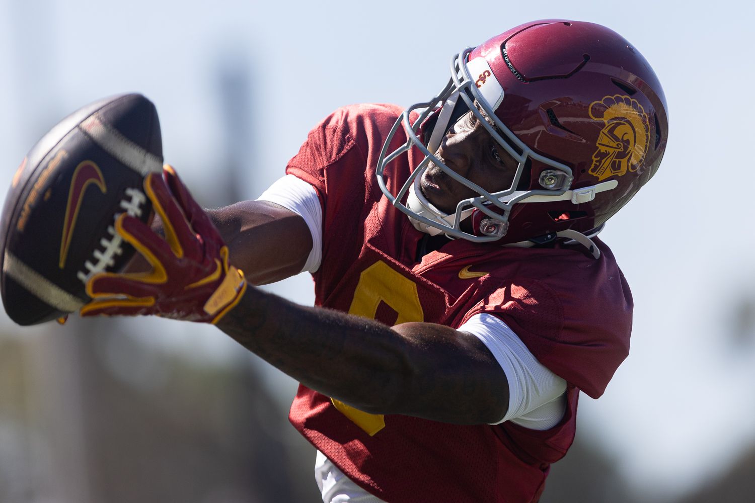 Terrell Anderson reaches for a pass at USC practice