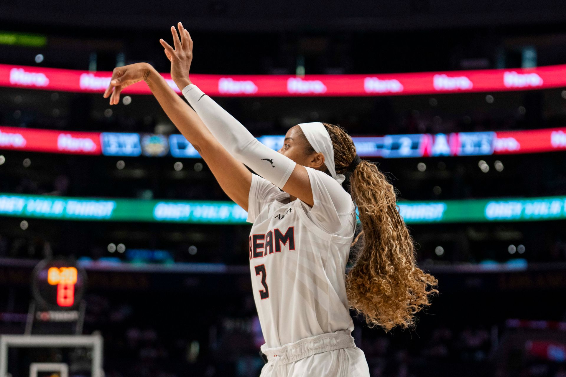 Jordin Canada nails a three-pointer against the Sparks.