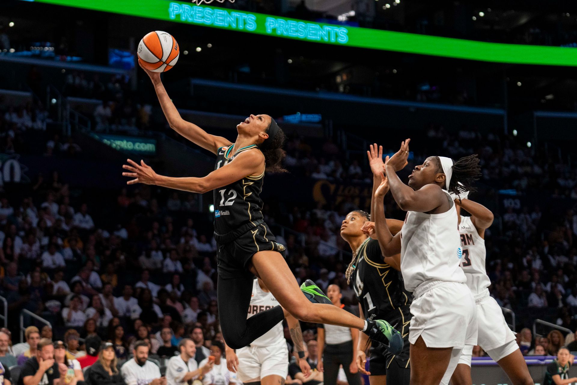 Rae Burrell fouled during a layup attempt against the Dream.