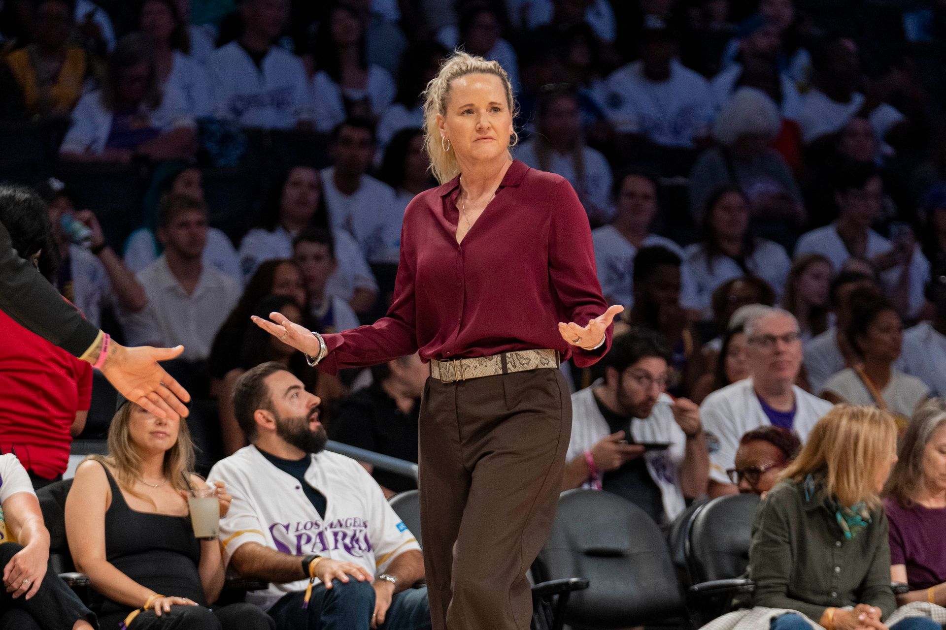Coach Lynne Roberts ponders next move after Sparks concede a basket.