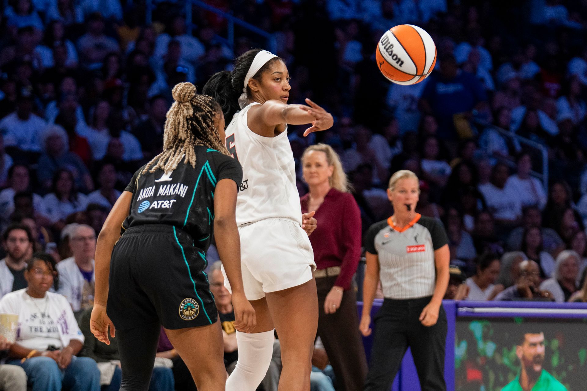 Angel Reese assists during a critical moment of the game.