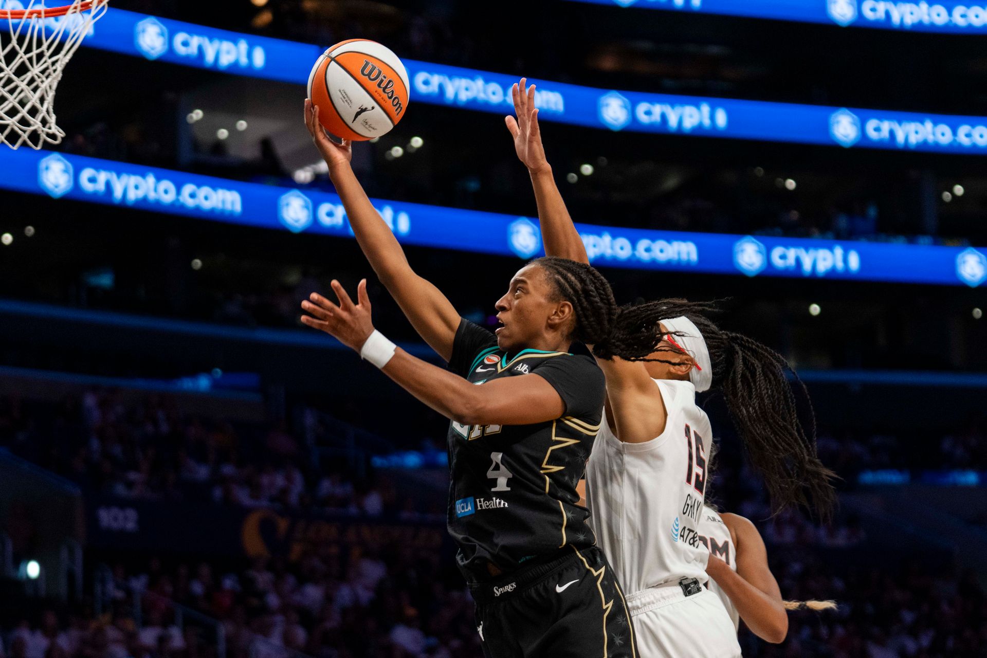 Tonie Morgan skillfully drives past the defense for a layup.