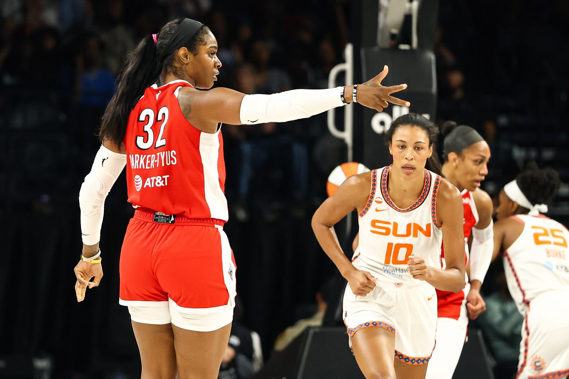 Cheyenne Parker-Tyus celebrates a three-pointer against the Sun