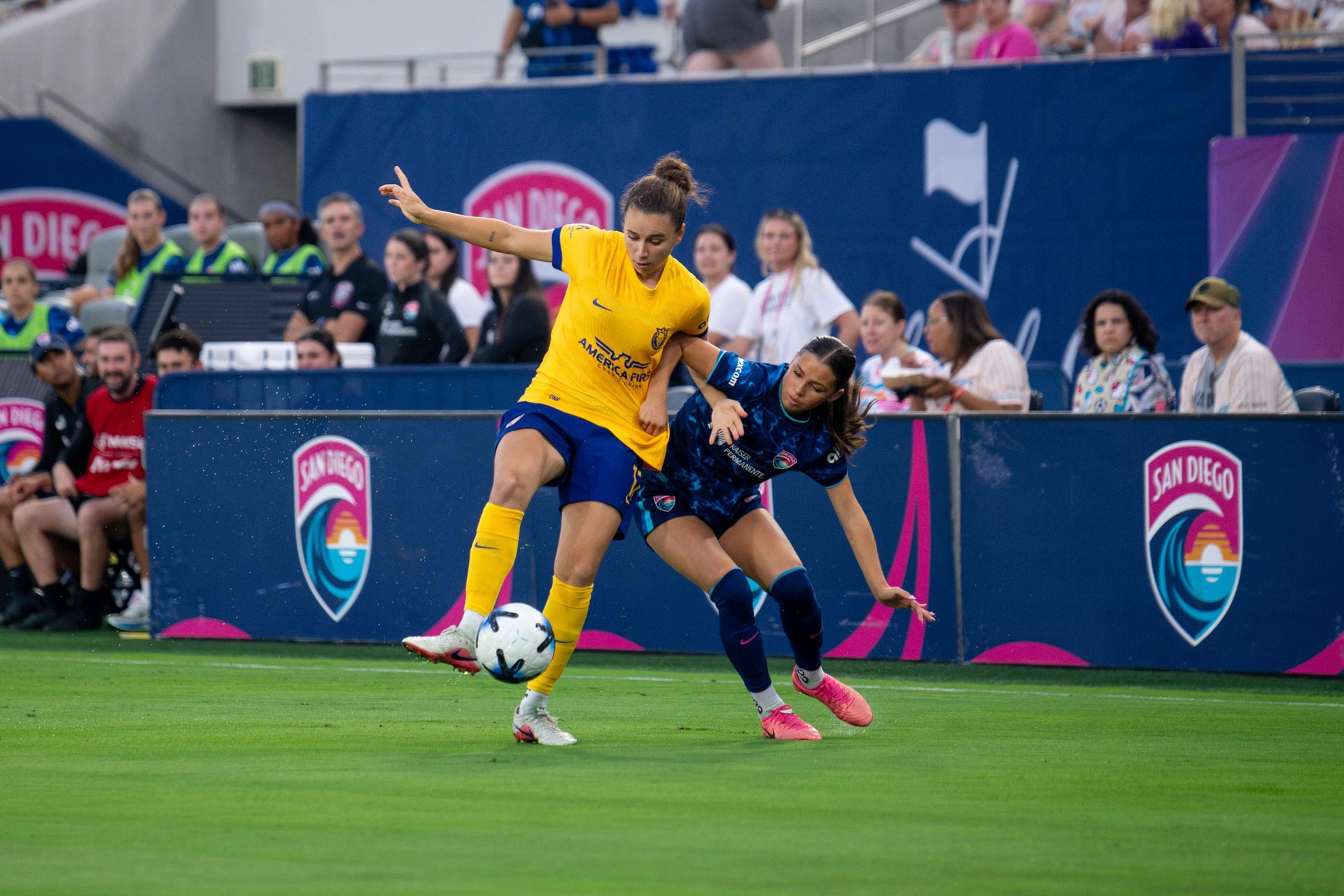 Melanie Barcenas battles Ana Tejada for the ball in a heated NWSL clash.