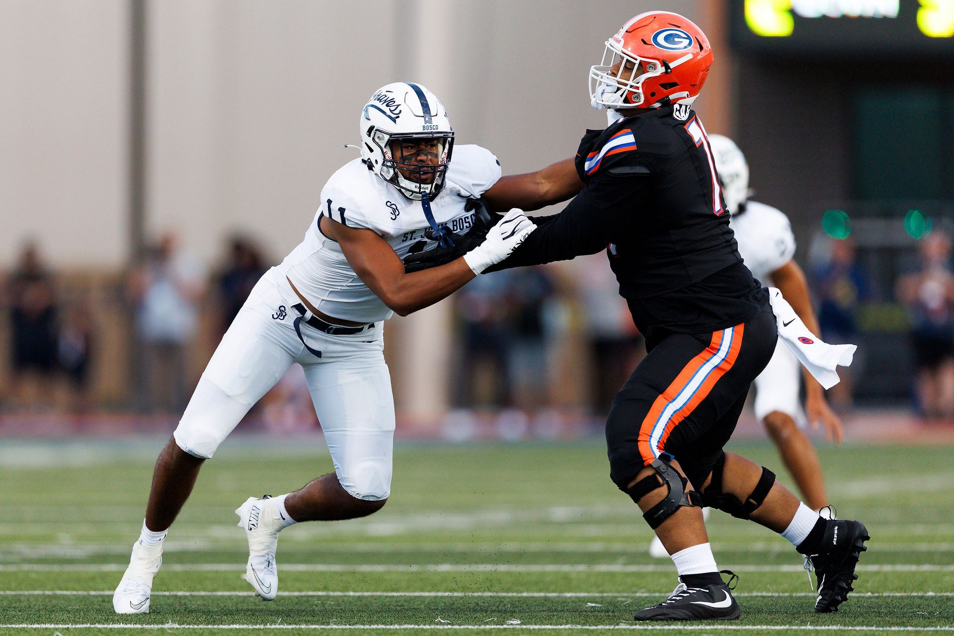 Elijah Tuua rushes the edge for St. John Bosco against Bishop Gorman