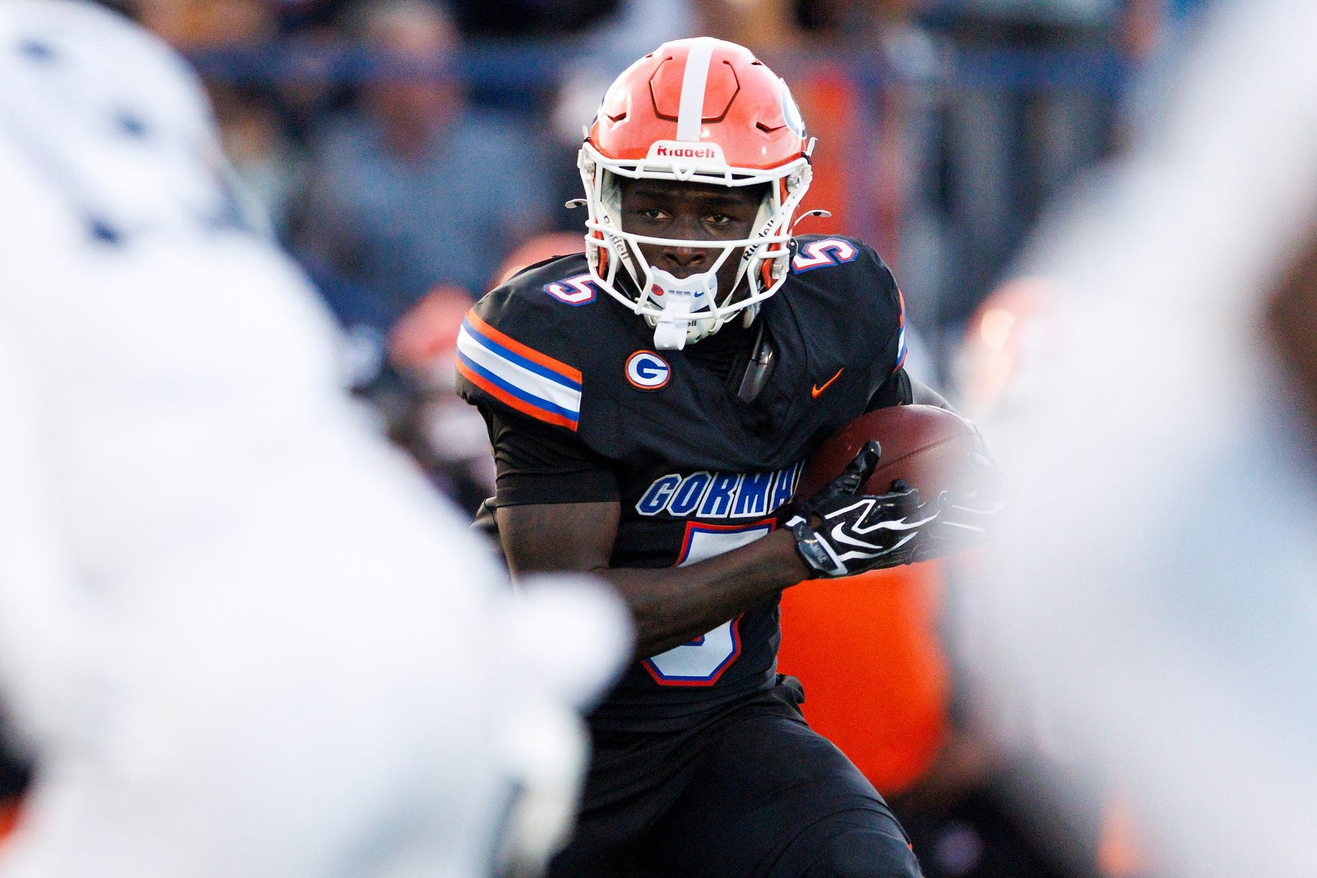 Corey Hinton carries the ball for Bishop Gorman against St. John Bosco