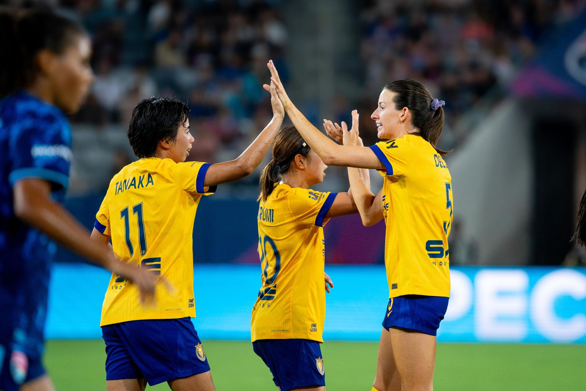 Mina Tanaka celebrates a goal with Cecelia Kizer in NWSL game.