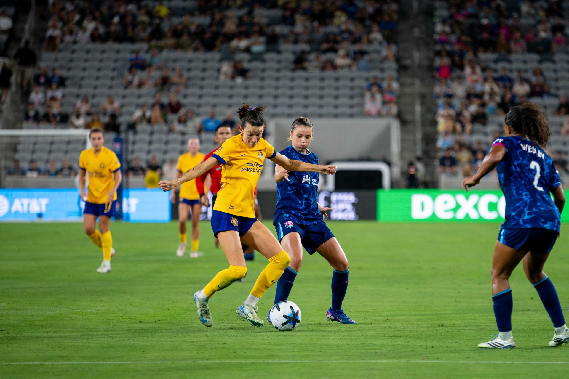 Cecelia Kizer competes for possession in intense NWSL match.
