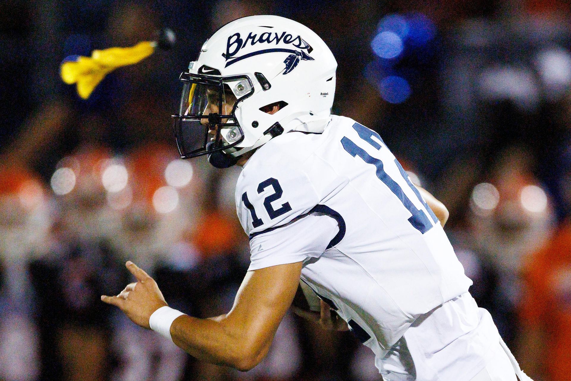 Koa Malau'ulu runs with the ball during a flagged play against Bishop Gorman