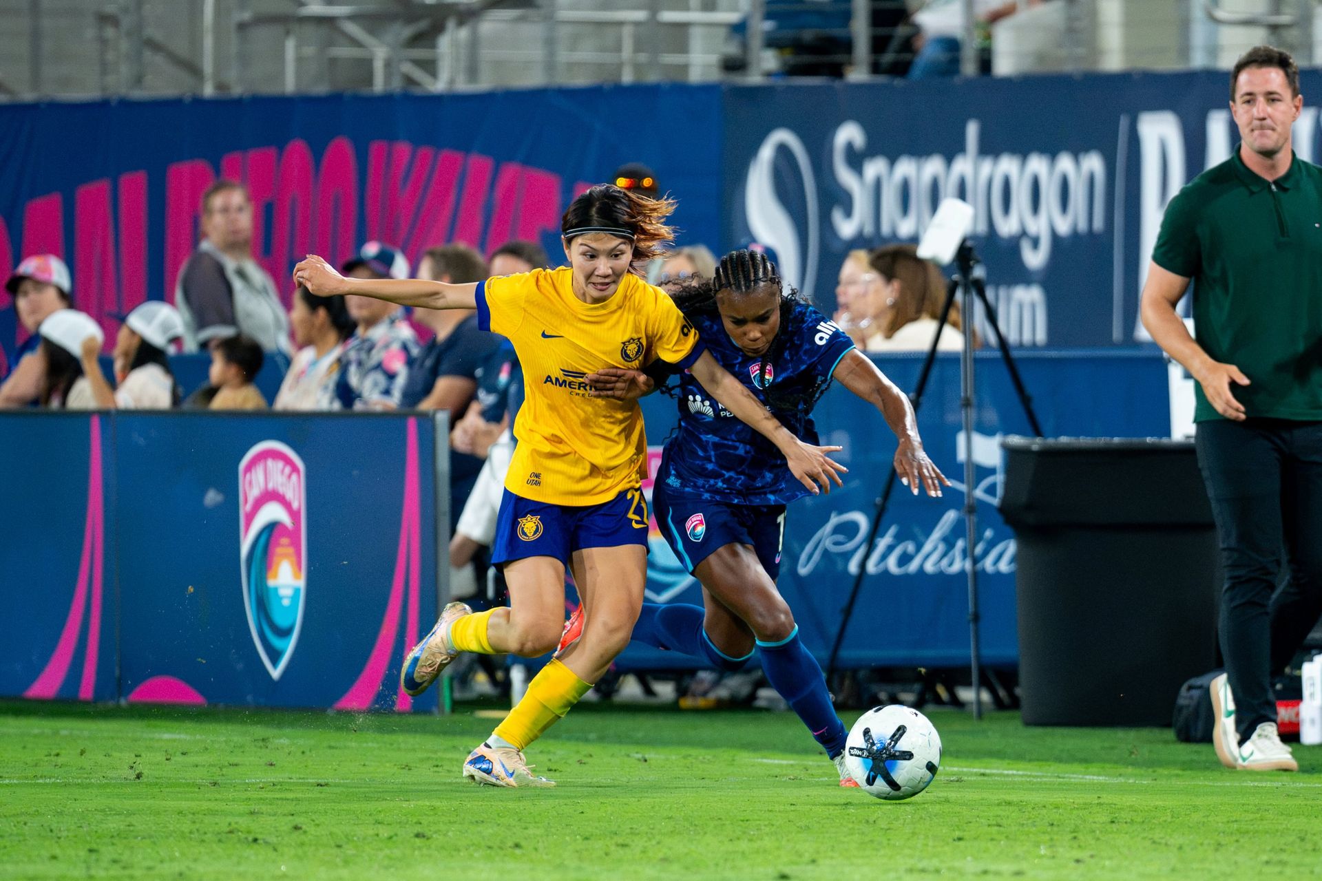 Ludmila engages in a fierce ball battle in NWSL game.
