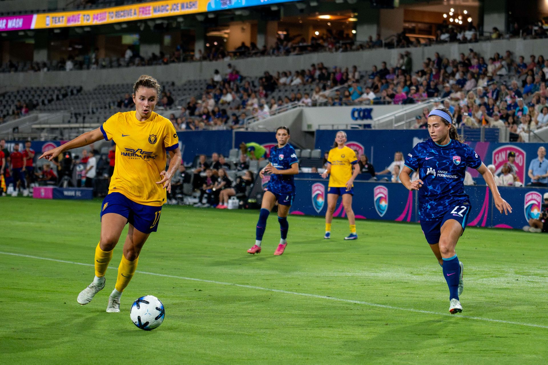 Ana Tejada outmaneuvers Lia Godfrey in NWSL match.