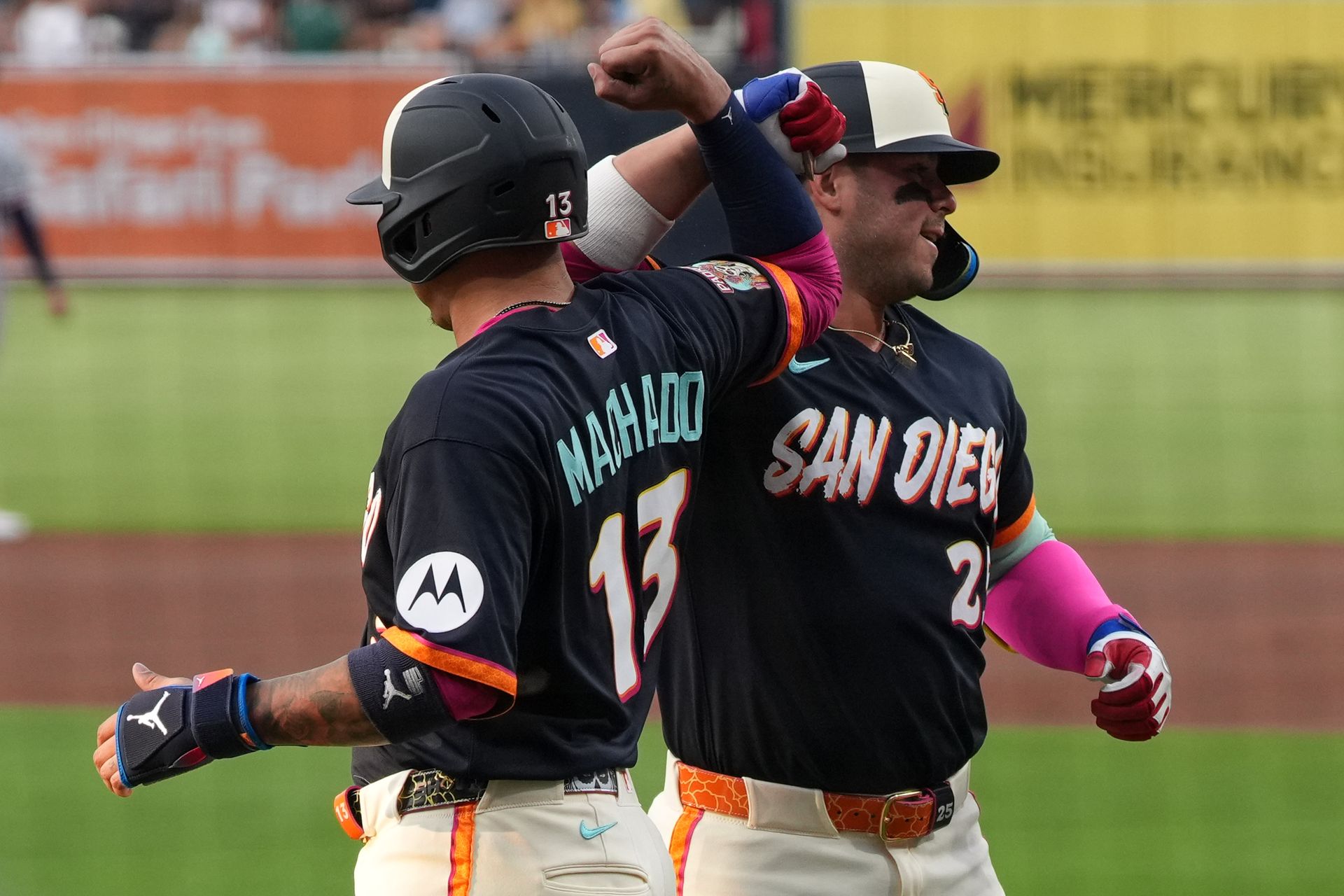 Machado and France celebrate a home run at Petco Park