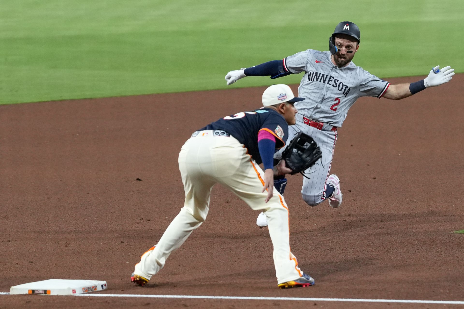 Kody Clemens slides to third base against the Padres