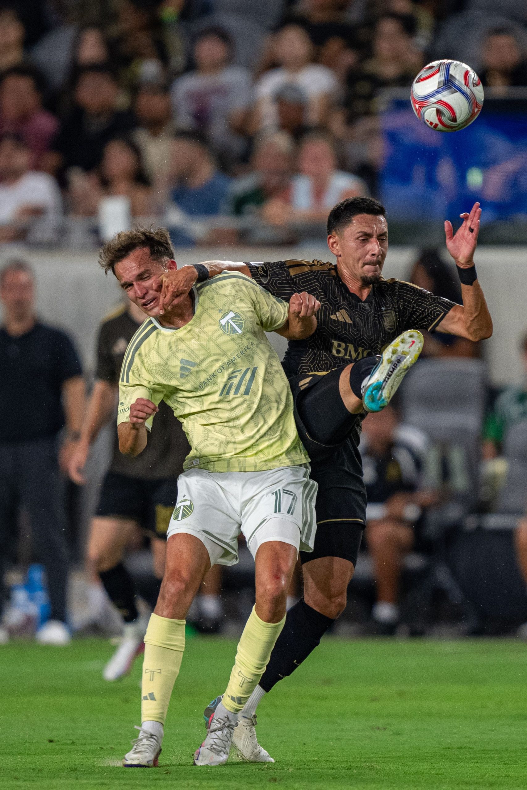 Mark Delgado battles for the ball in MLS game