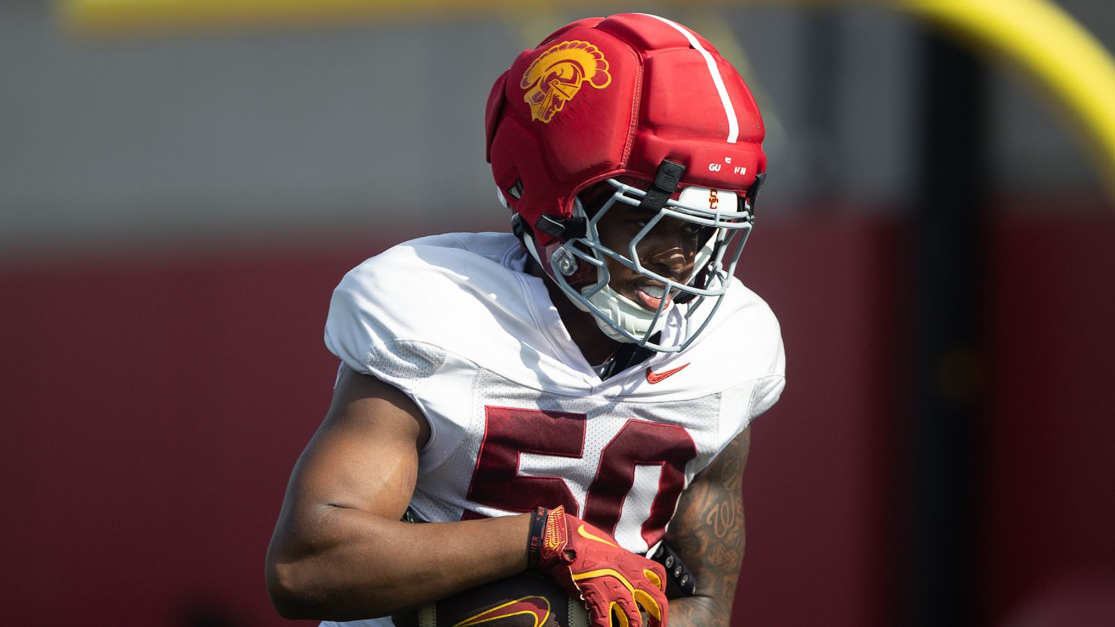 Taylor Johnson (50) Carries Ball in Practice