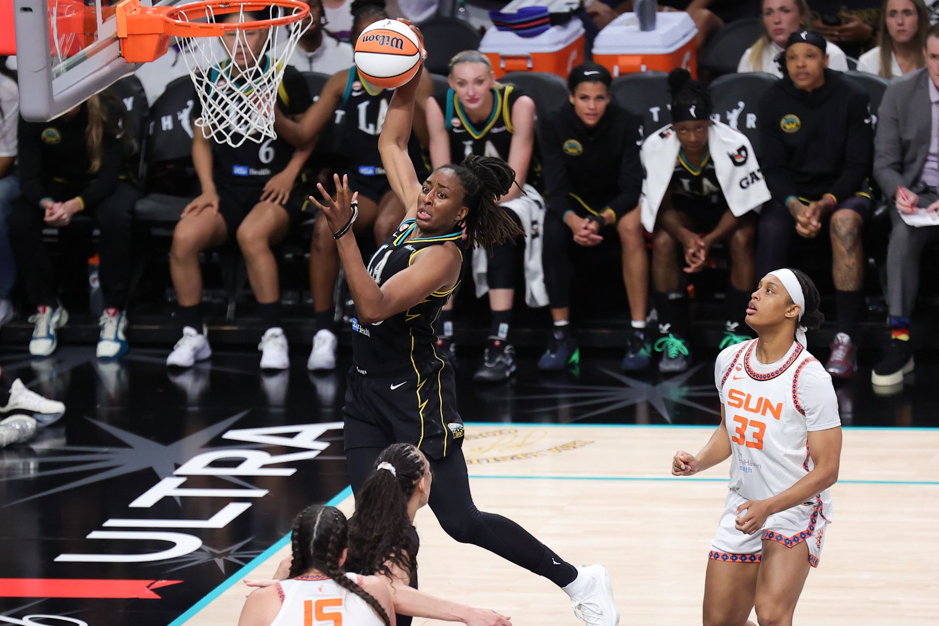 Nneka Ogwumike secures a rebound for the Sparks against the Sun