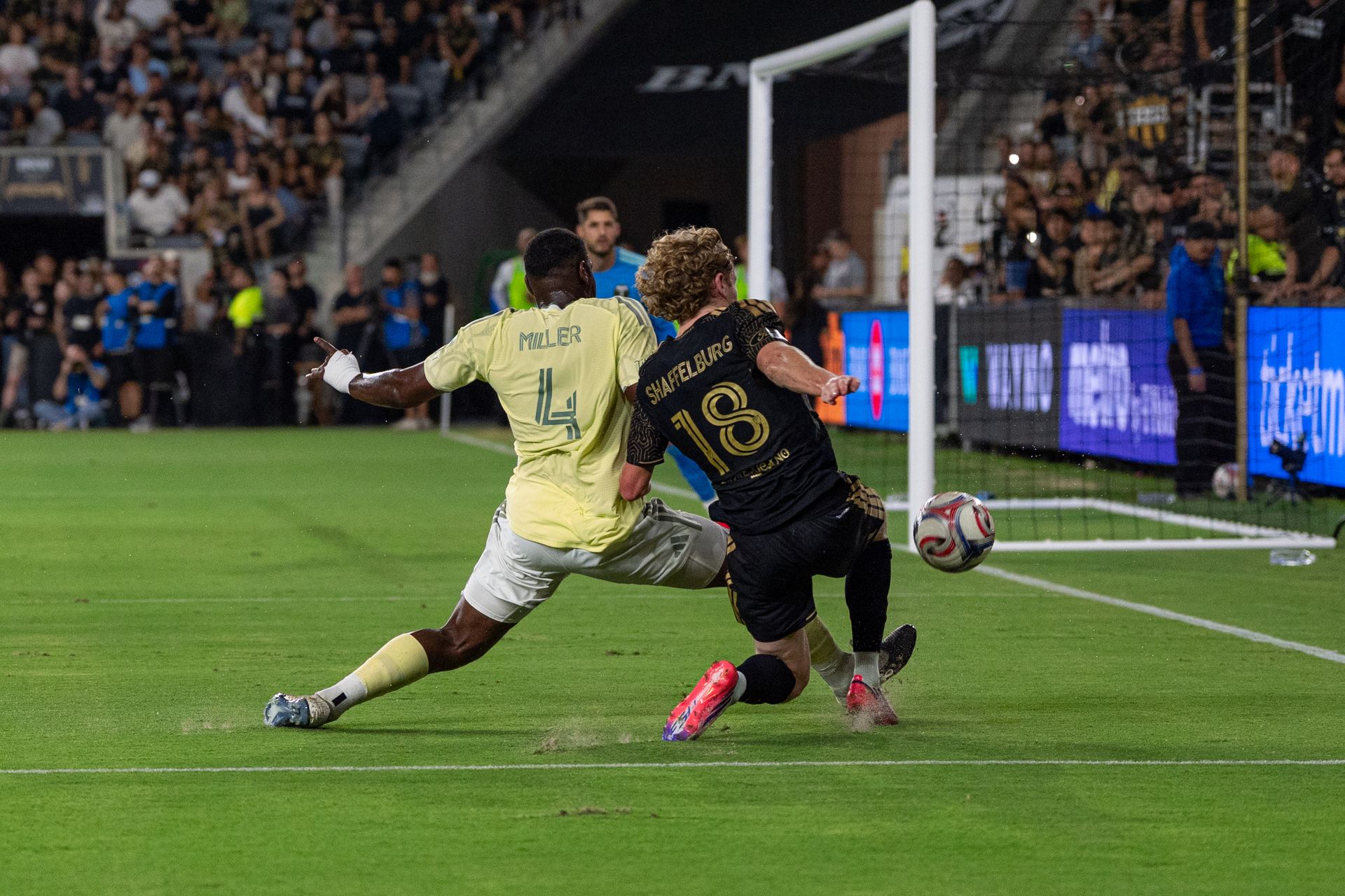 Jacob Shaffelburg fights for a shot on goal