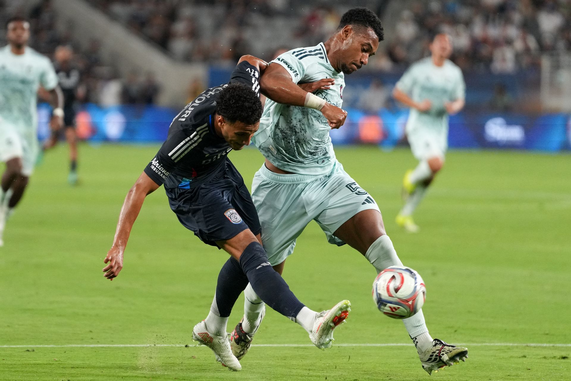 Elias Achouri attempts a shot in MLS game
