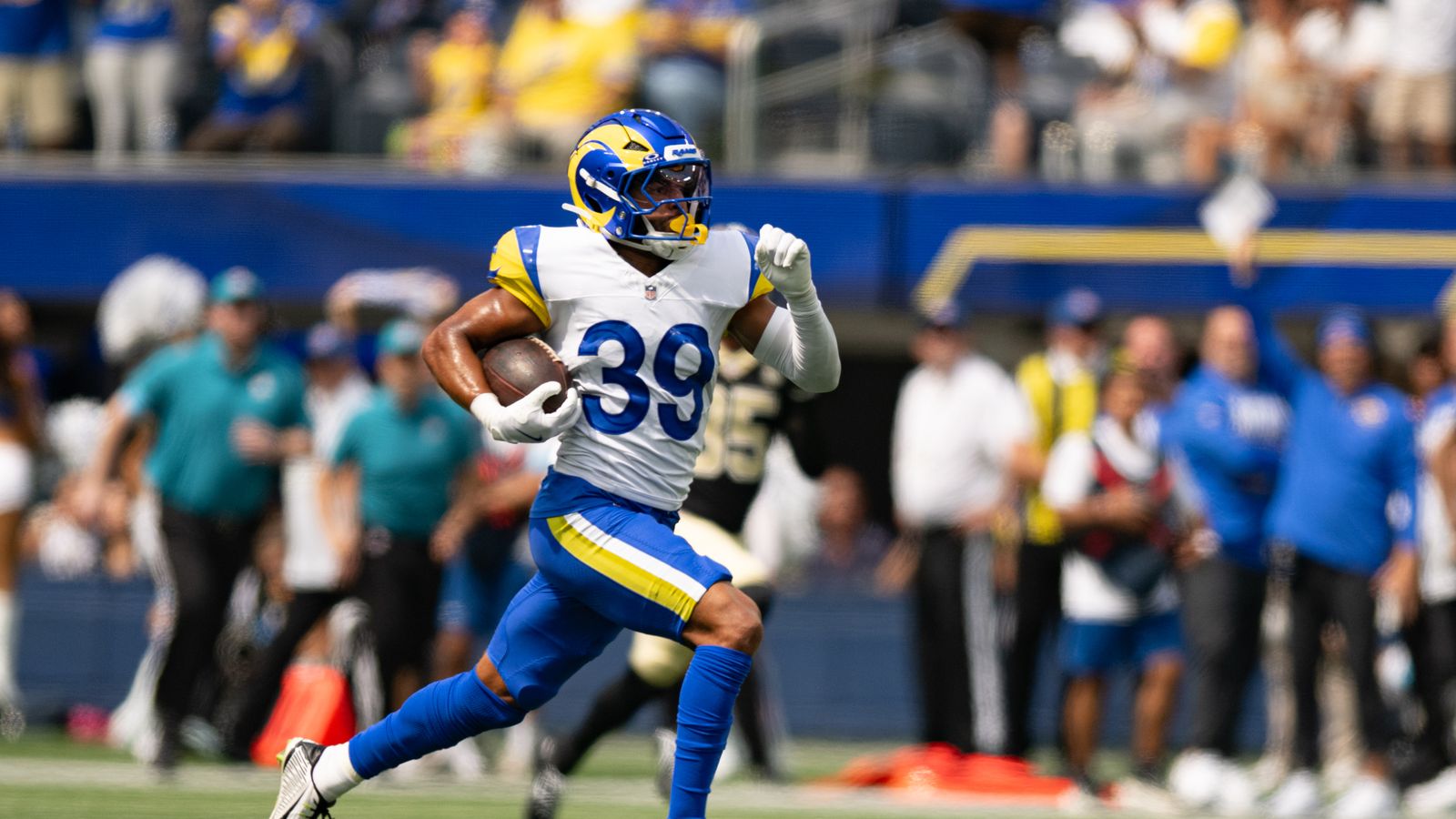 Alex Cook scores a touchdown for the Rams in preseason action against the Saints.