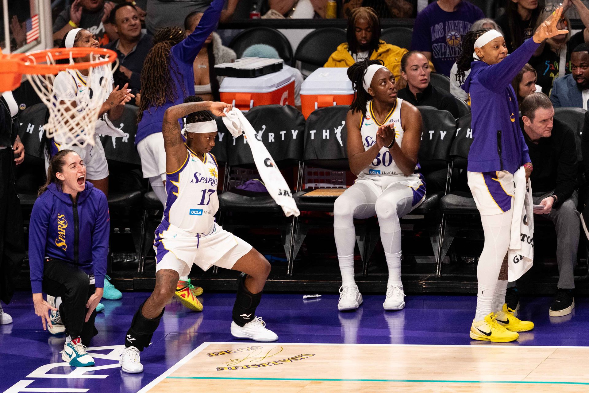LA Sparks bench celebrates during a game vs Atlanta Dream