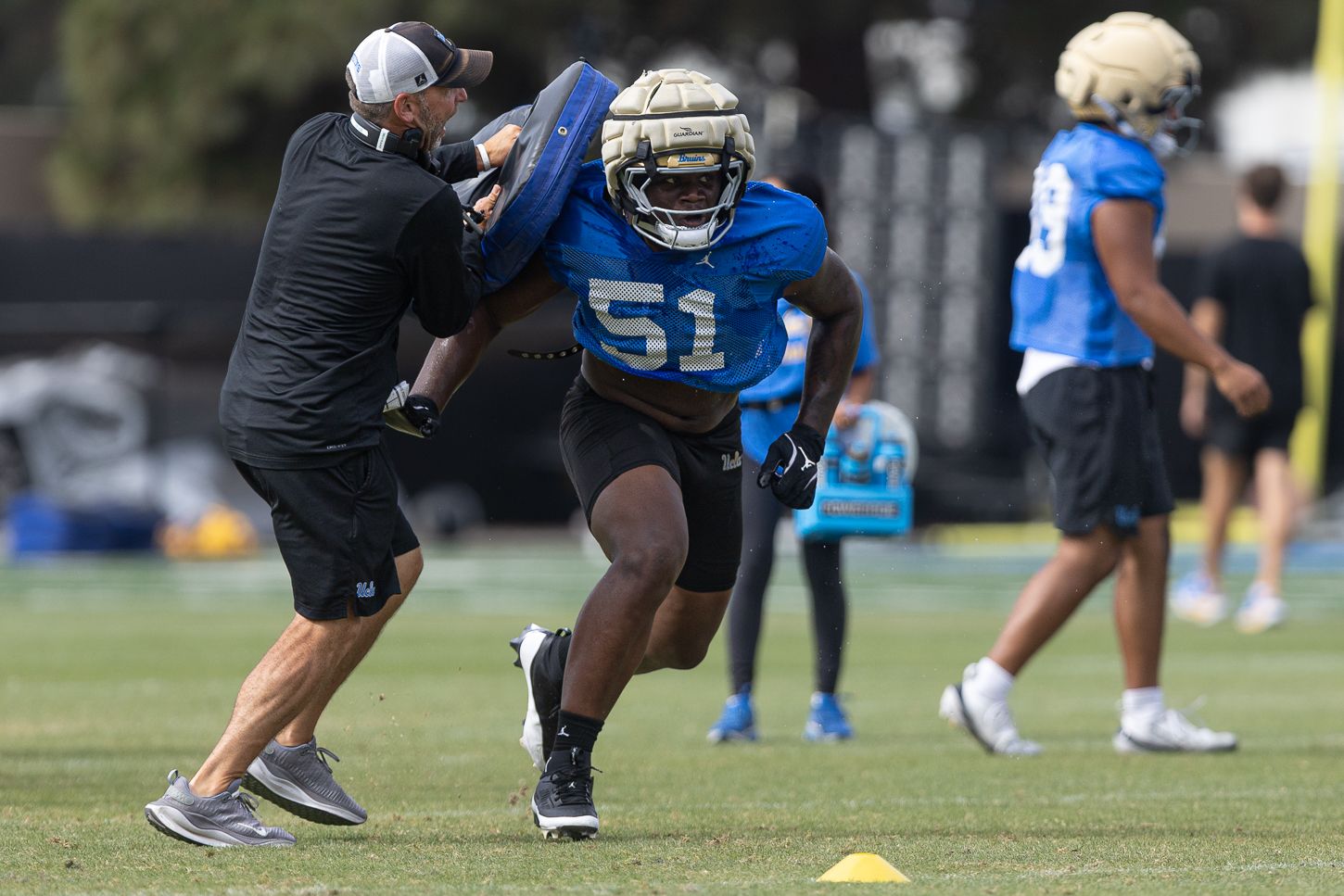 Trent Hendrick (51) active in UCLA football practice
