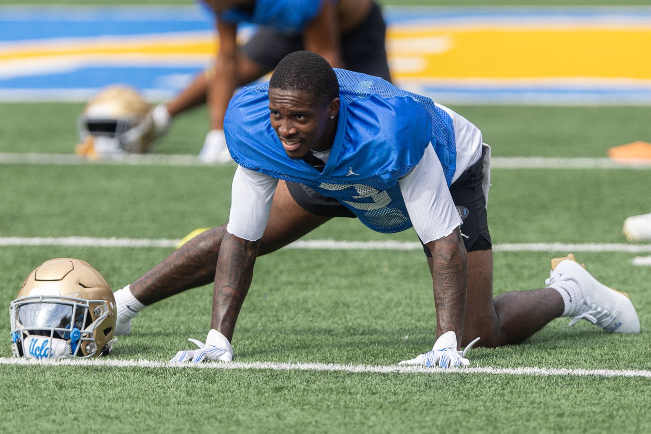 Robert Stafford III (3) stretches at UCLA practice session