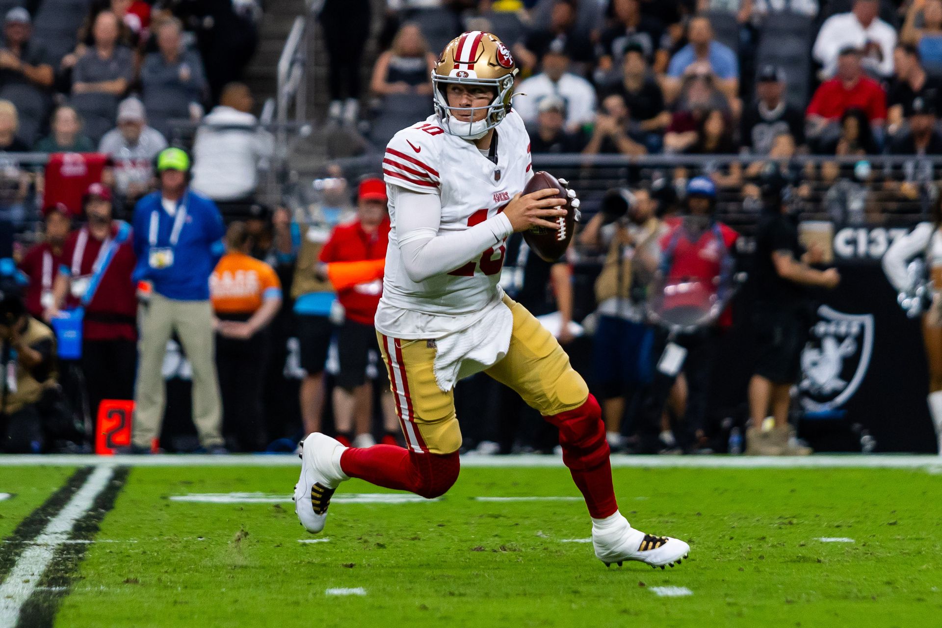 49ers QB Mac Jones maneuvers out of the pocket