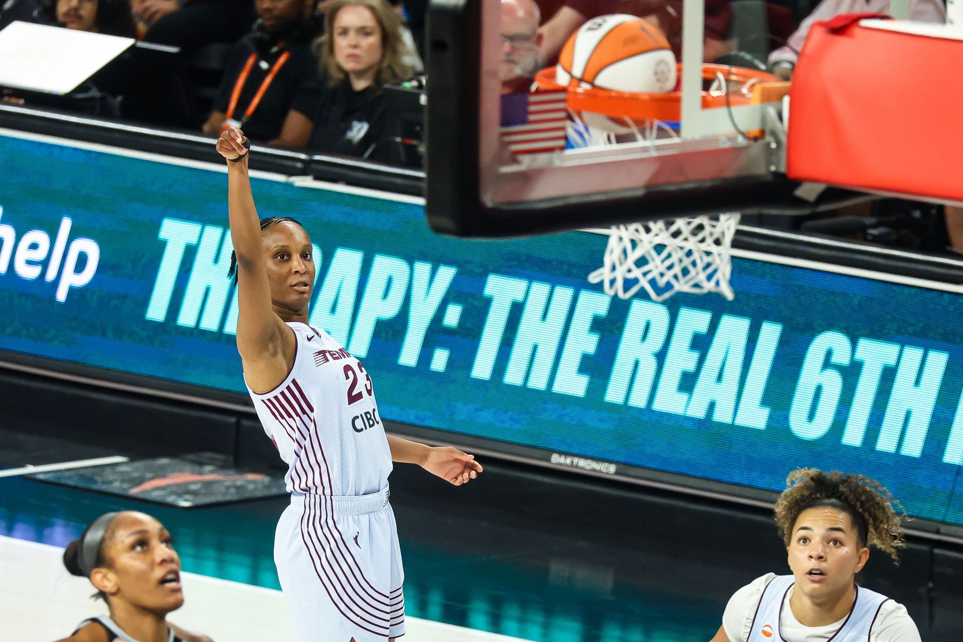 Kiana Williams makes a three-point shot against the Las Vegas Aces.