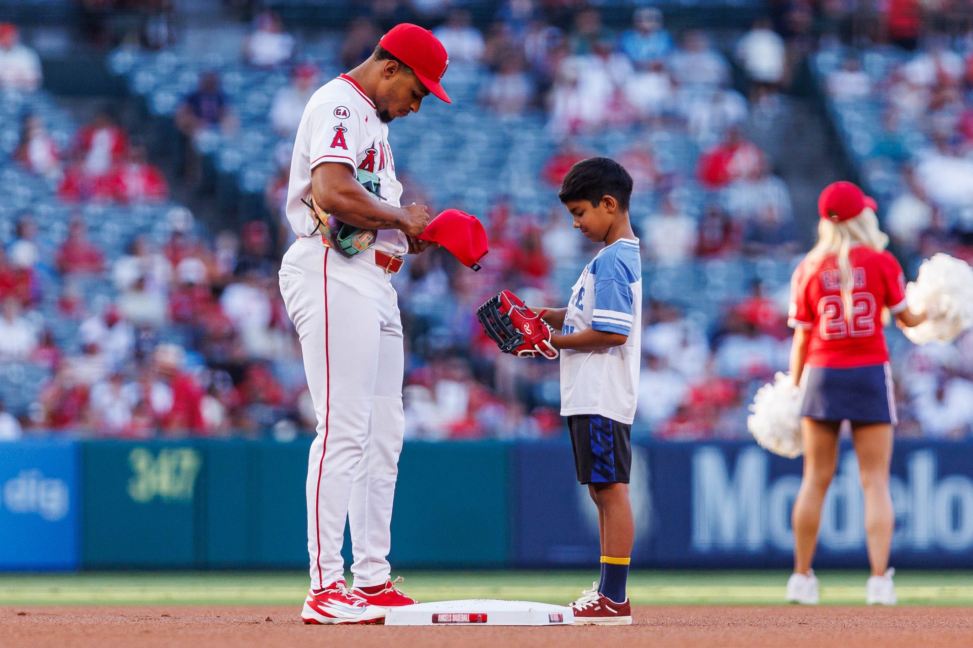 Christian Moore #4 signs autographs before MLB game in Anaheim.