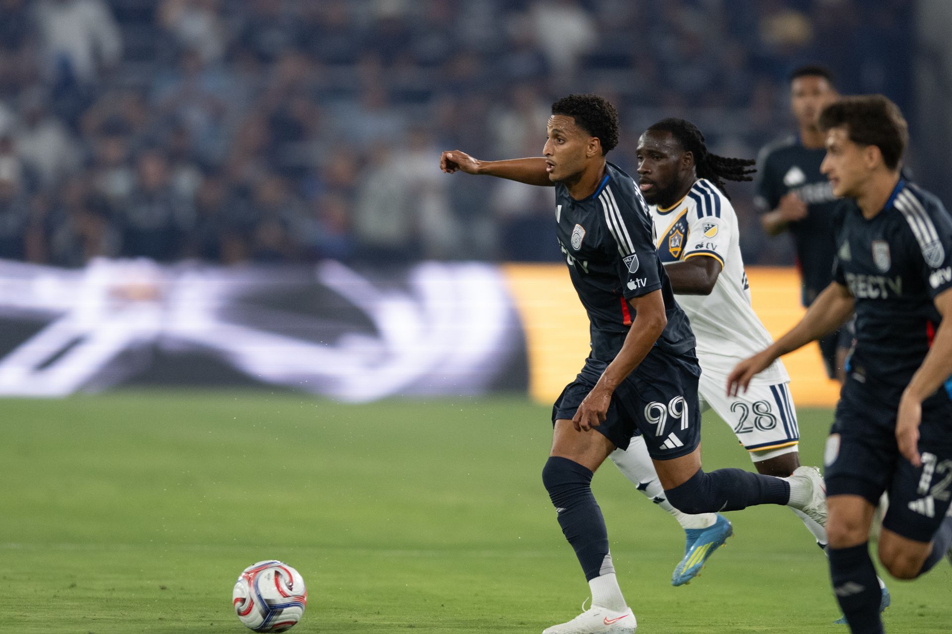Elias Achouri maneuvers through LA Galaxy defenders