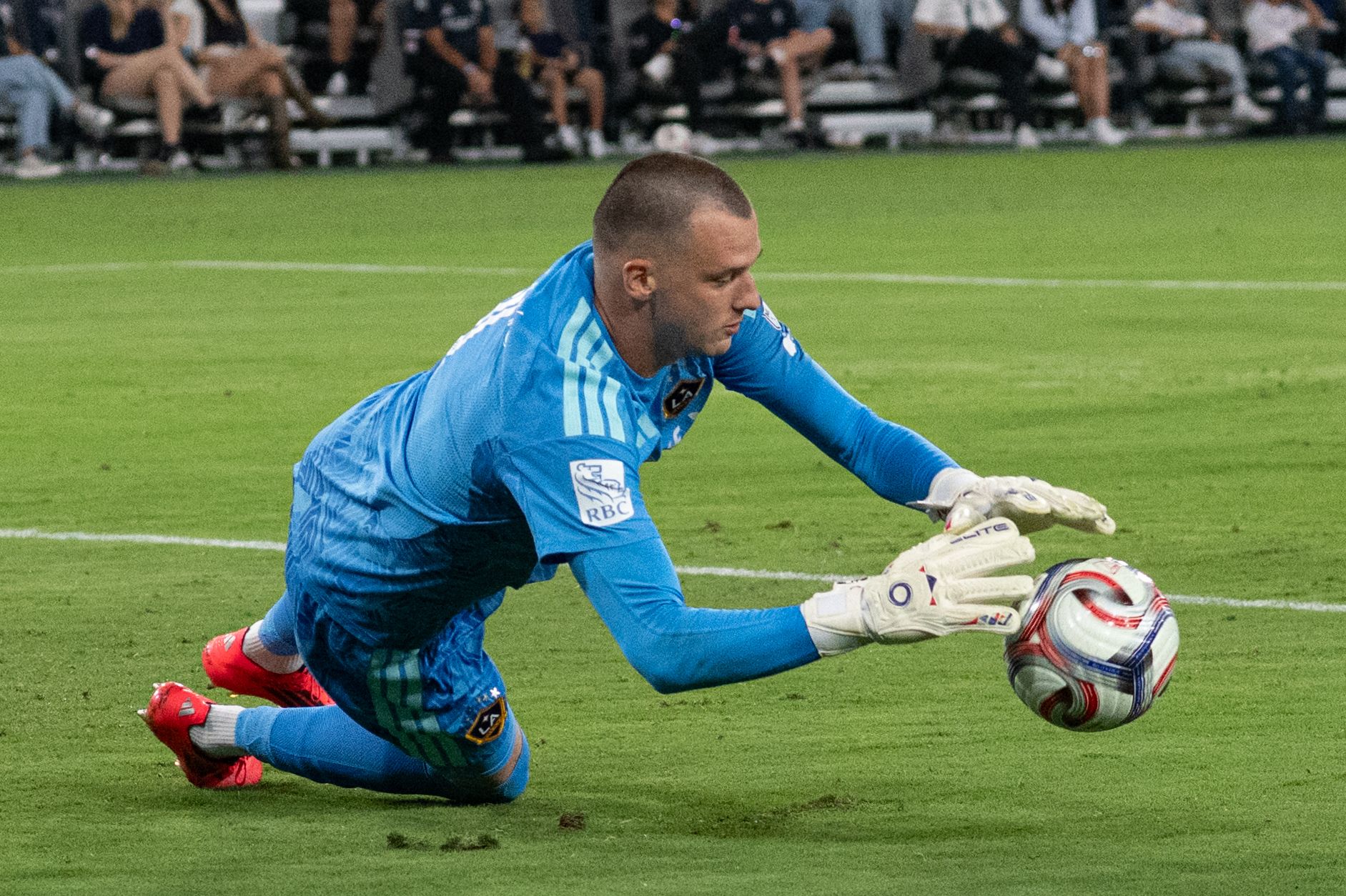 Novak Micovic dives for a save against San Diego FC