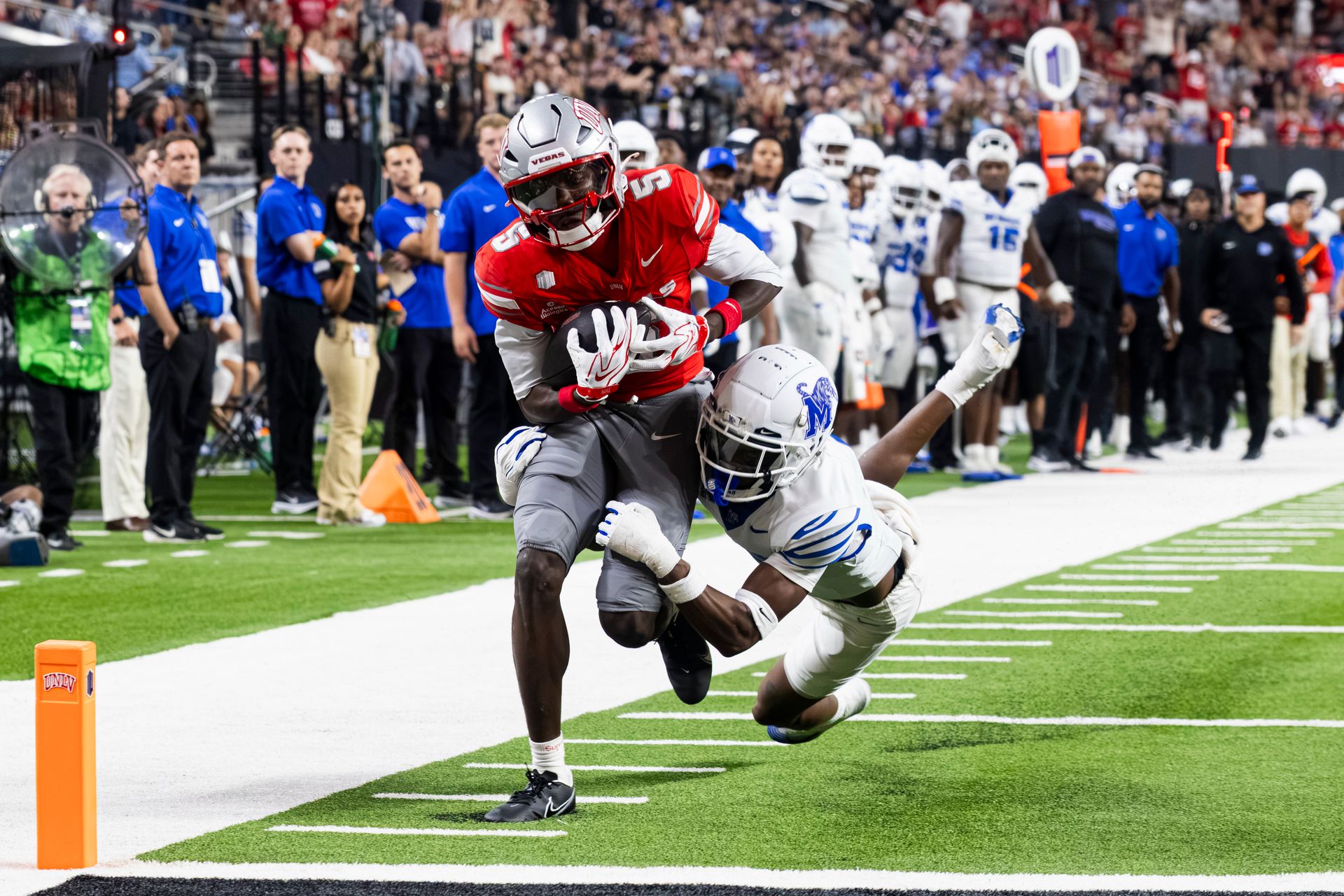 Tavian McNair scores a touchdown against Memphis